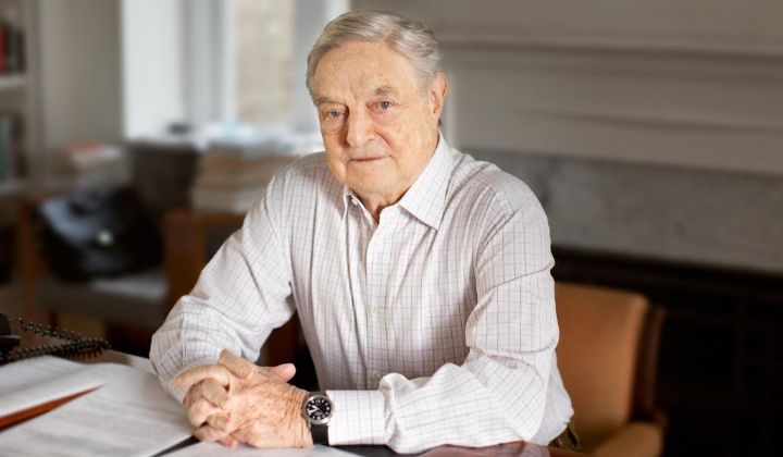 George Soros sitting in his office